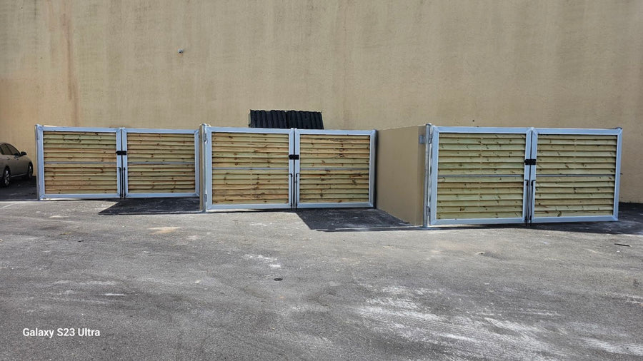 Louvered Gates in Front of Dumpster
