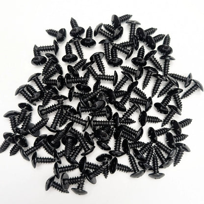 A pile of 100 5/8" black stainless steel truss-head screws, scattered on a white background.
