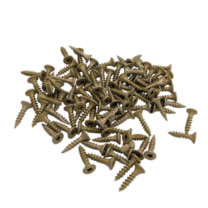 A pile of about 90 bronze torx-head wood screws scattered on a plain white background.