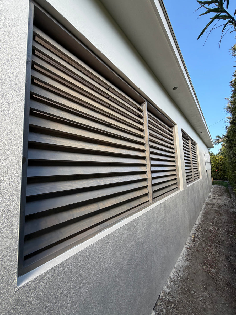 Louvered panels in an outside terraced structure. 