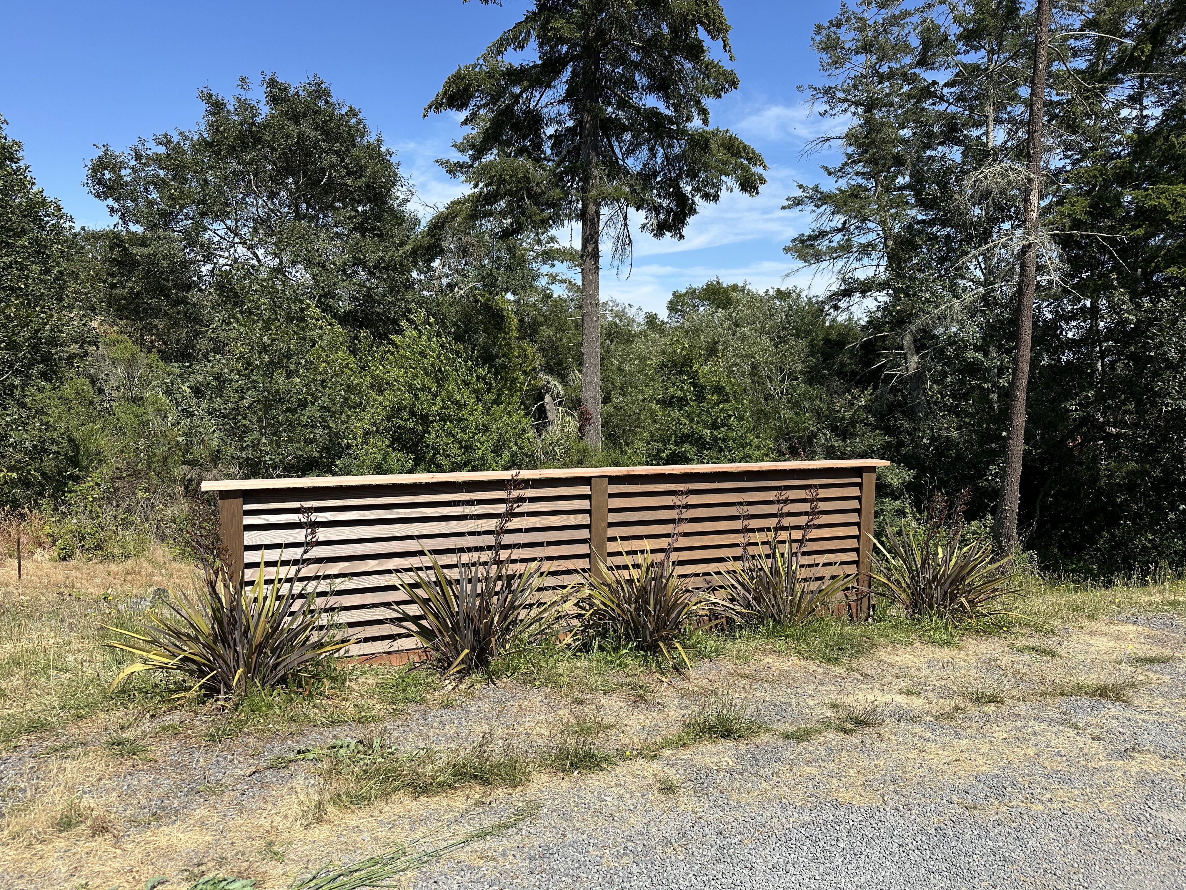 Louvered screen to hide propane tank